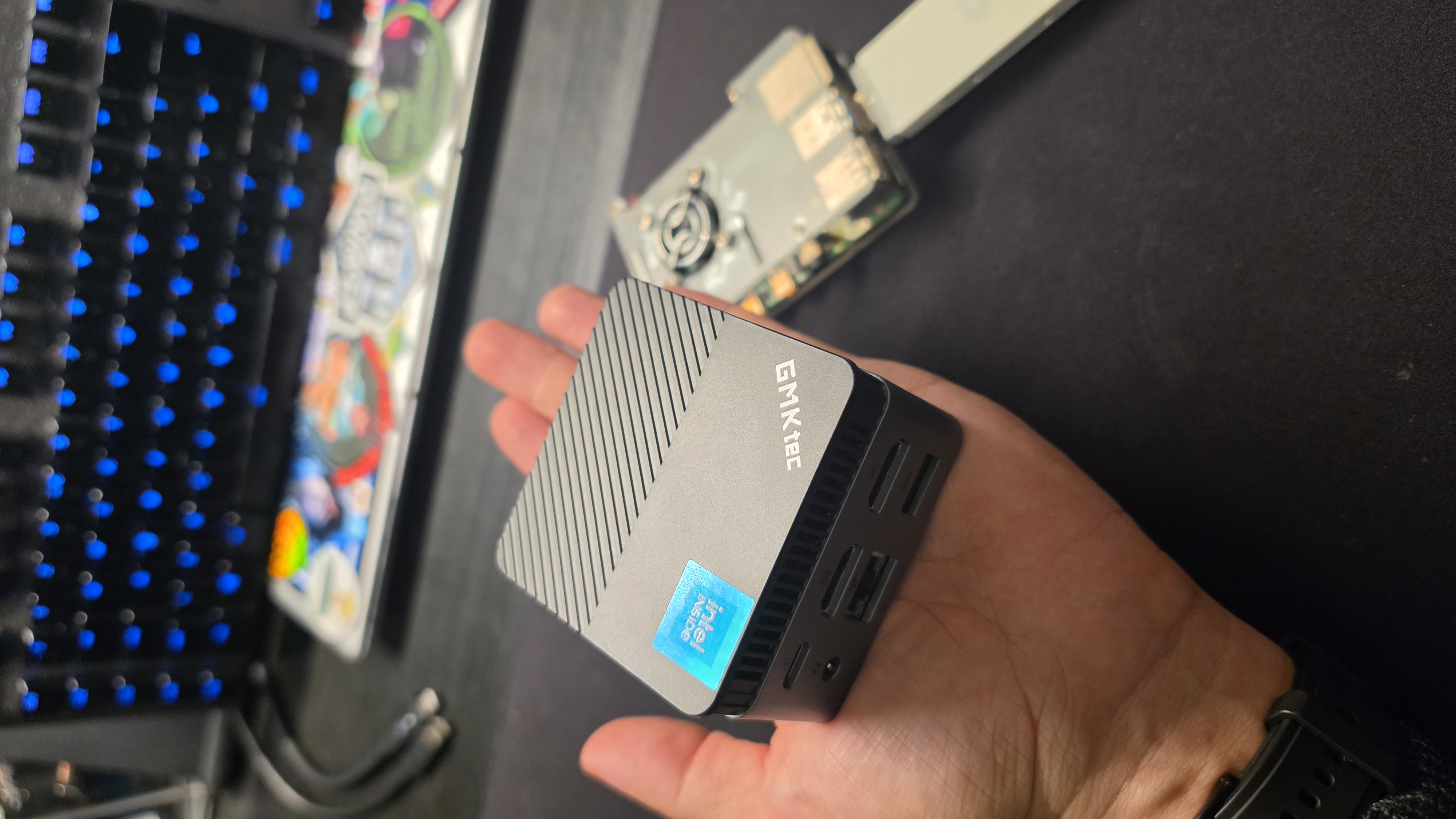 GMKtec NucBox G5 implant alongside a Raspberry Pi 4 and cellular dongles